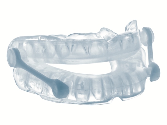 Dispositivo orale a due arcate con connettori laterali, immagine illustrativa.